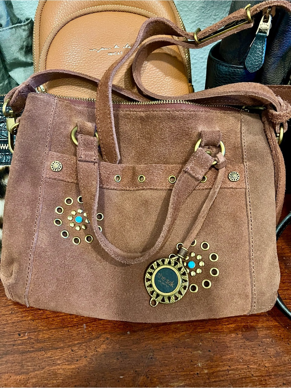 The Sak Brown Suede Shoulder Bag with Brass Accents